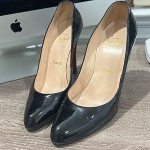 Christian Louboutin Solid black heel with red back